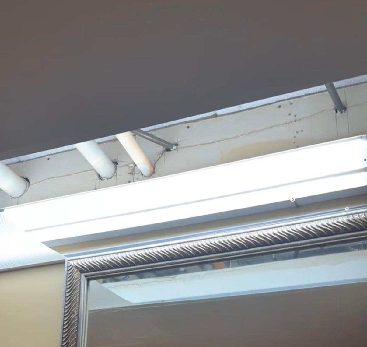 Roof open and exposed pipe in bathroom