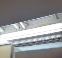Roof open and exposed pipe in bathroom