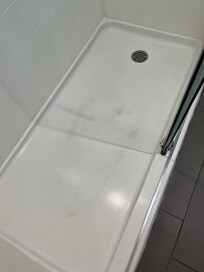 Shower floor was quite dirty looking. I placed a towel on the shower floor to stand on while I showered. The shower had phenomenal water pressure, however.