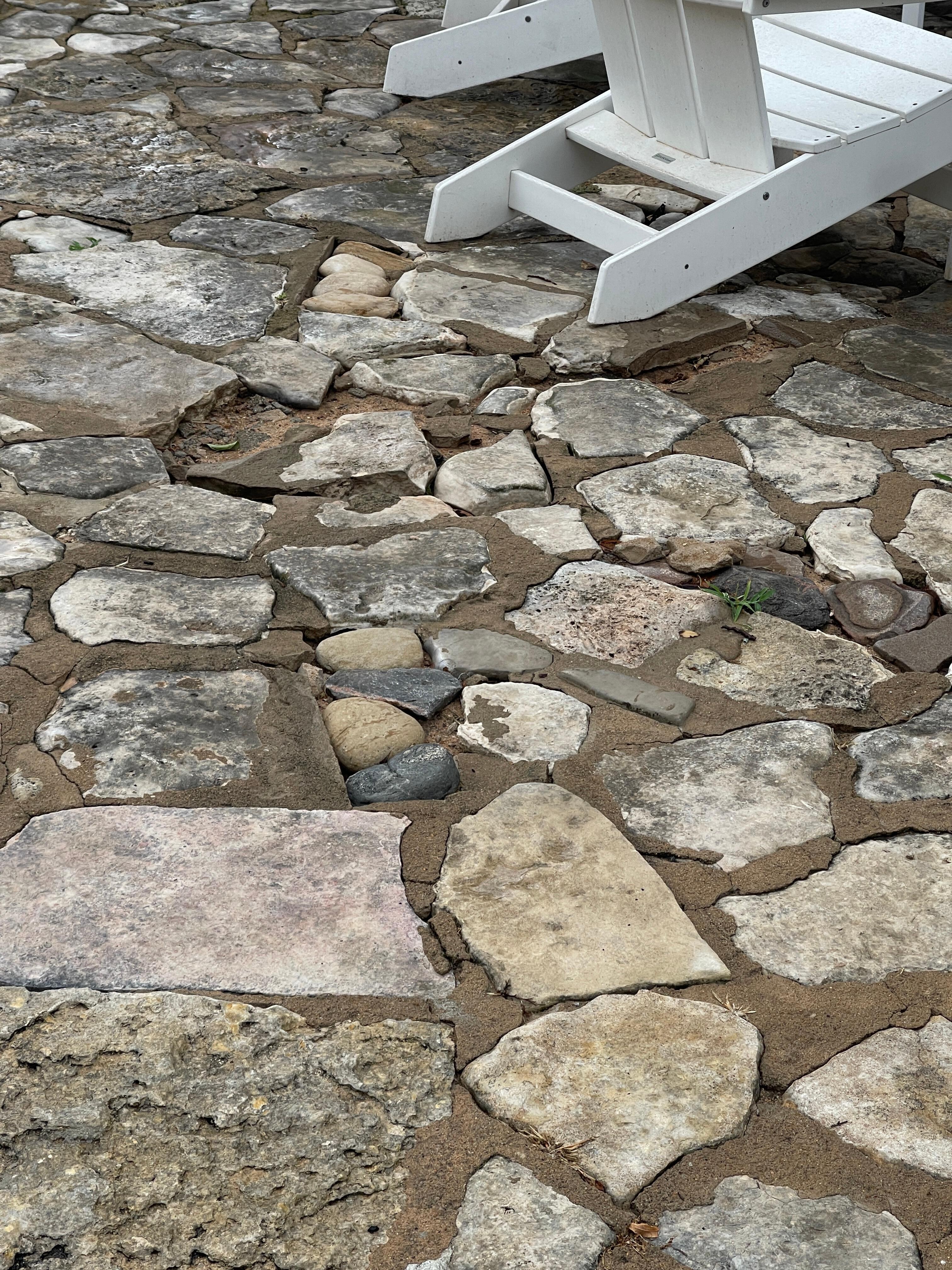 Flagstone missing. This may seem small, but this was so uneven that it was hard to walk on.