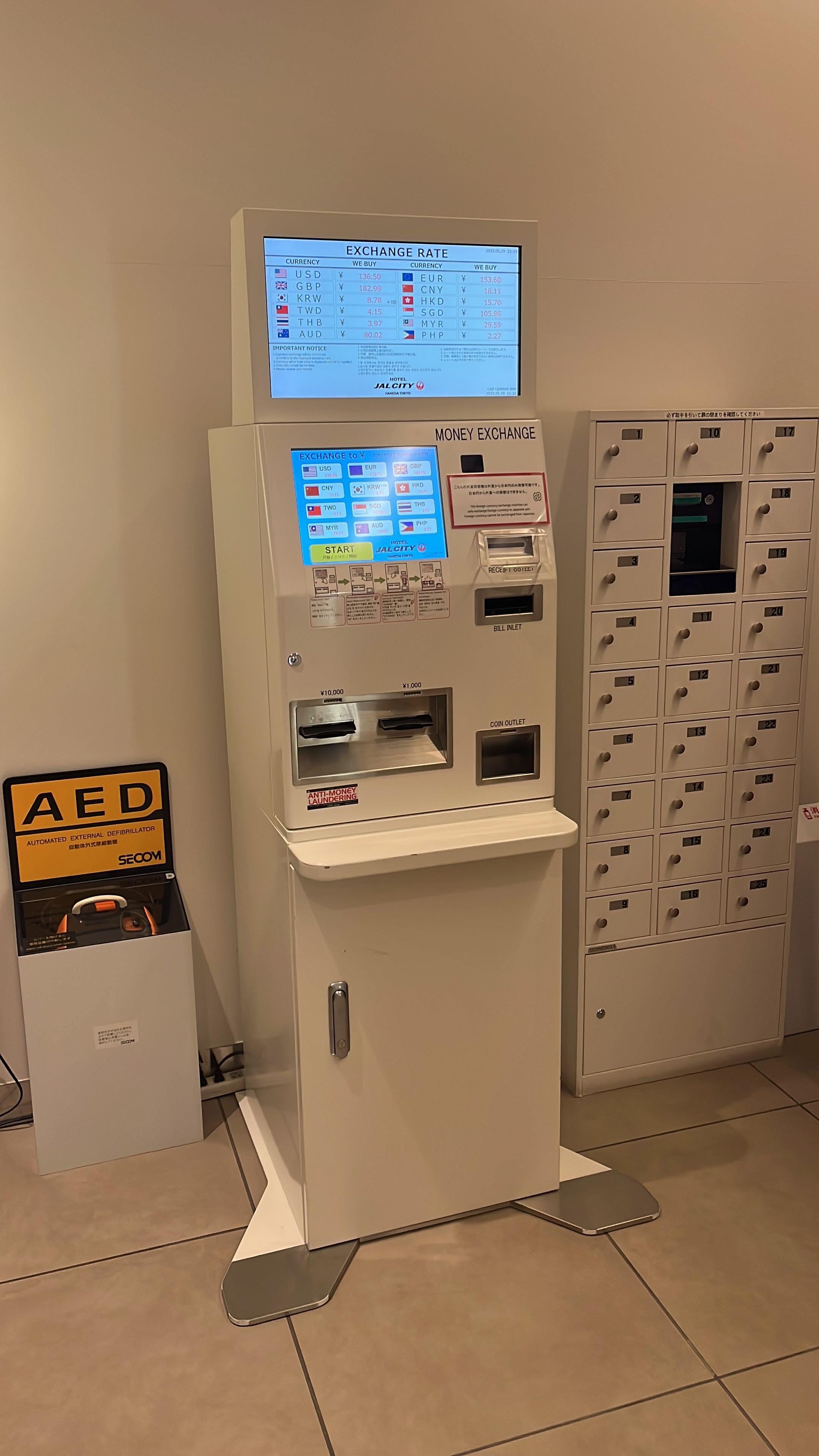 Automatic currency exchange next to the elevator