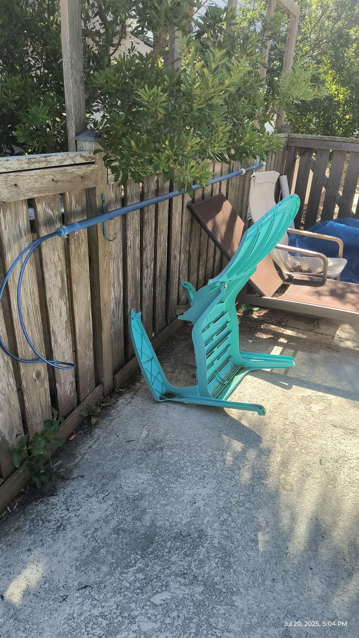 Broken chairs around pool