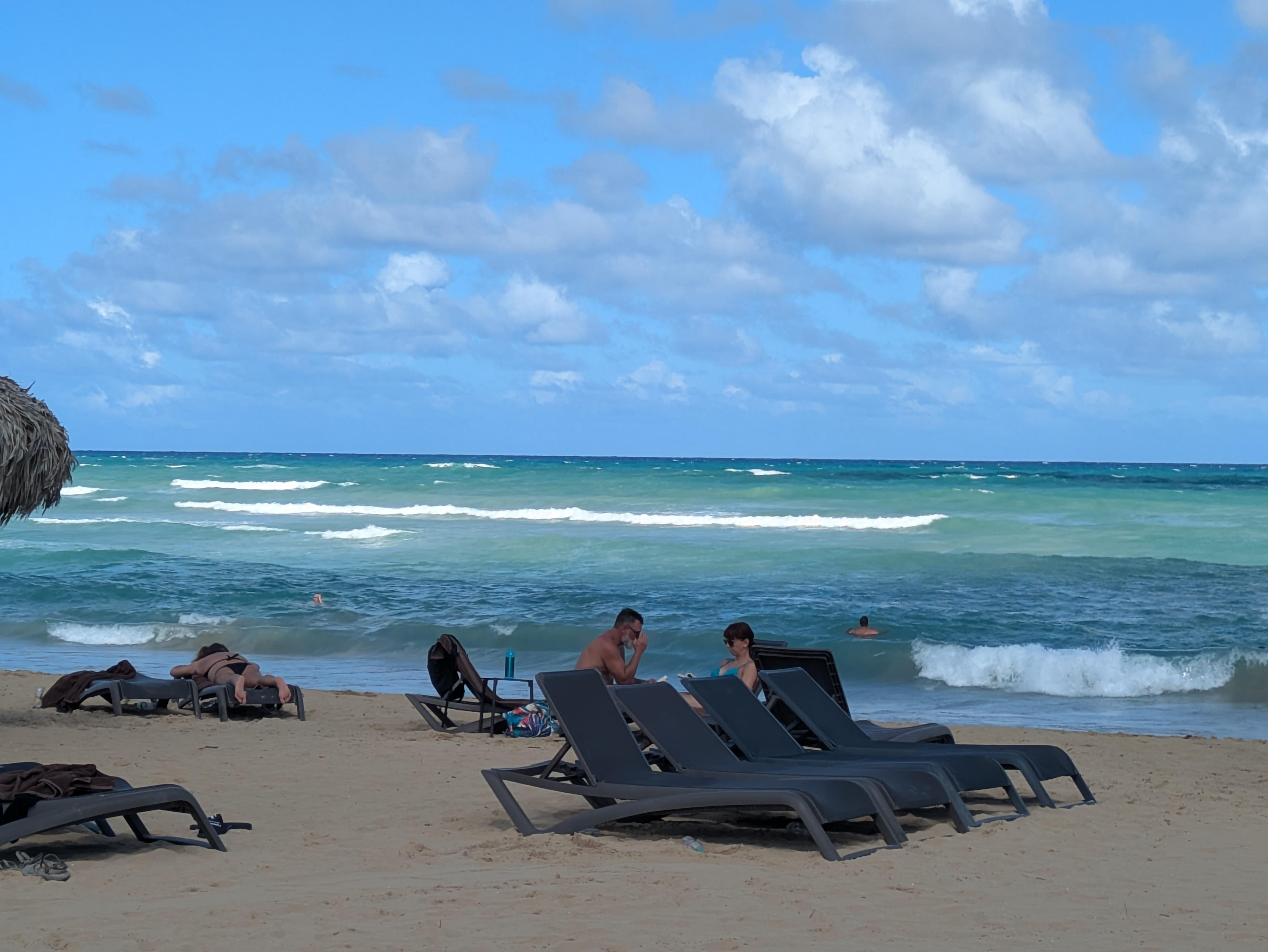 Clean beautiful beach with drinks and food  brought right to you chair.