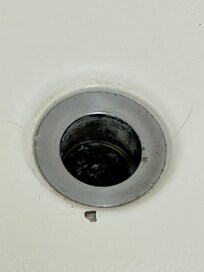 Hair in the bathtub drain, so gross!