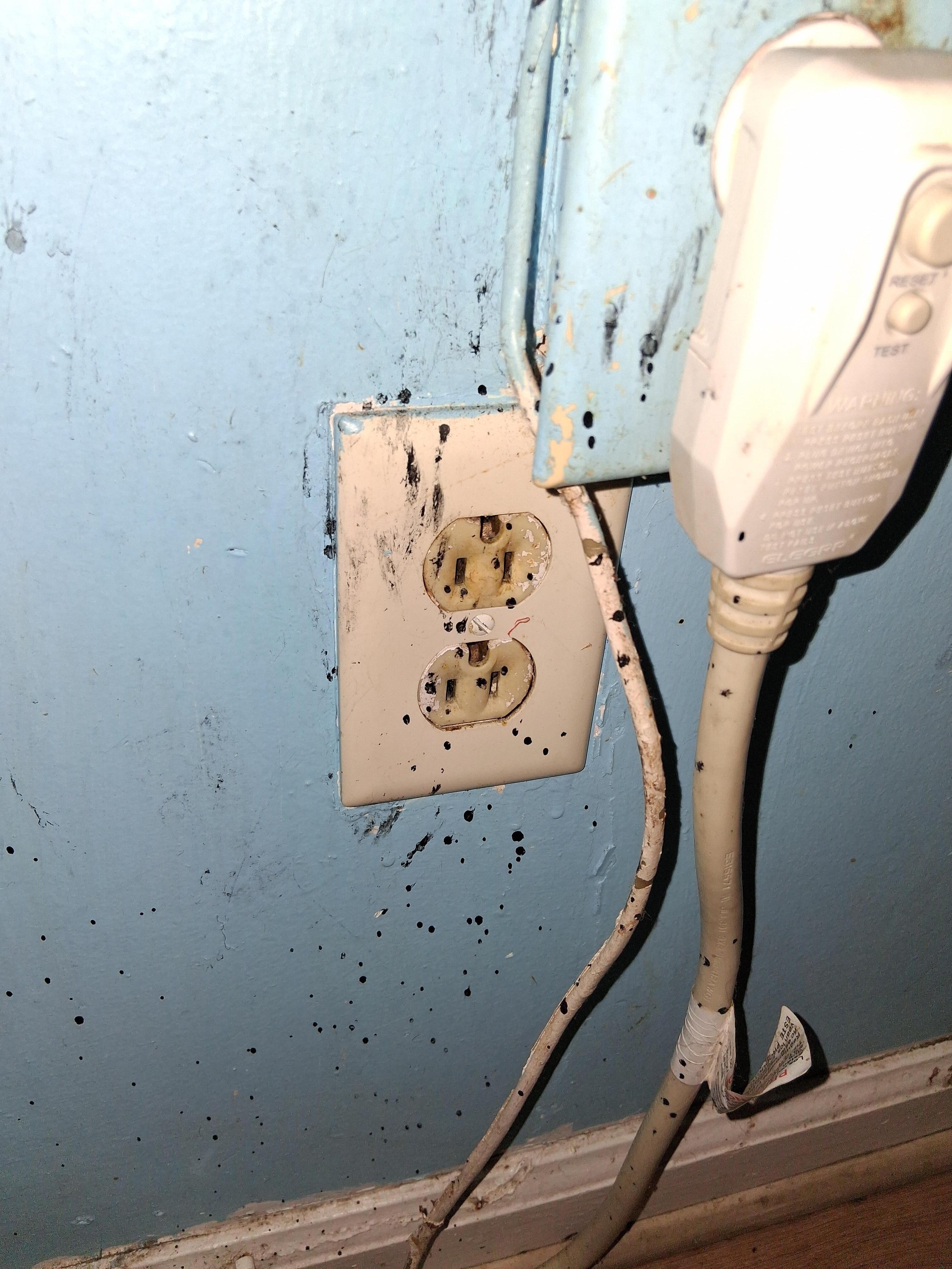 Outlet and wall by A/C