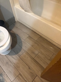 Water on floor from upstairs.