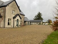 The main house with cottage in background