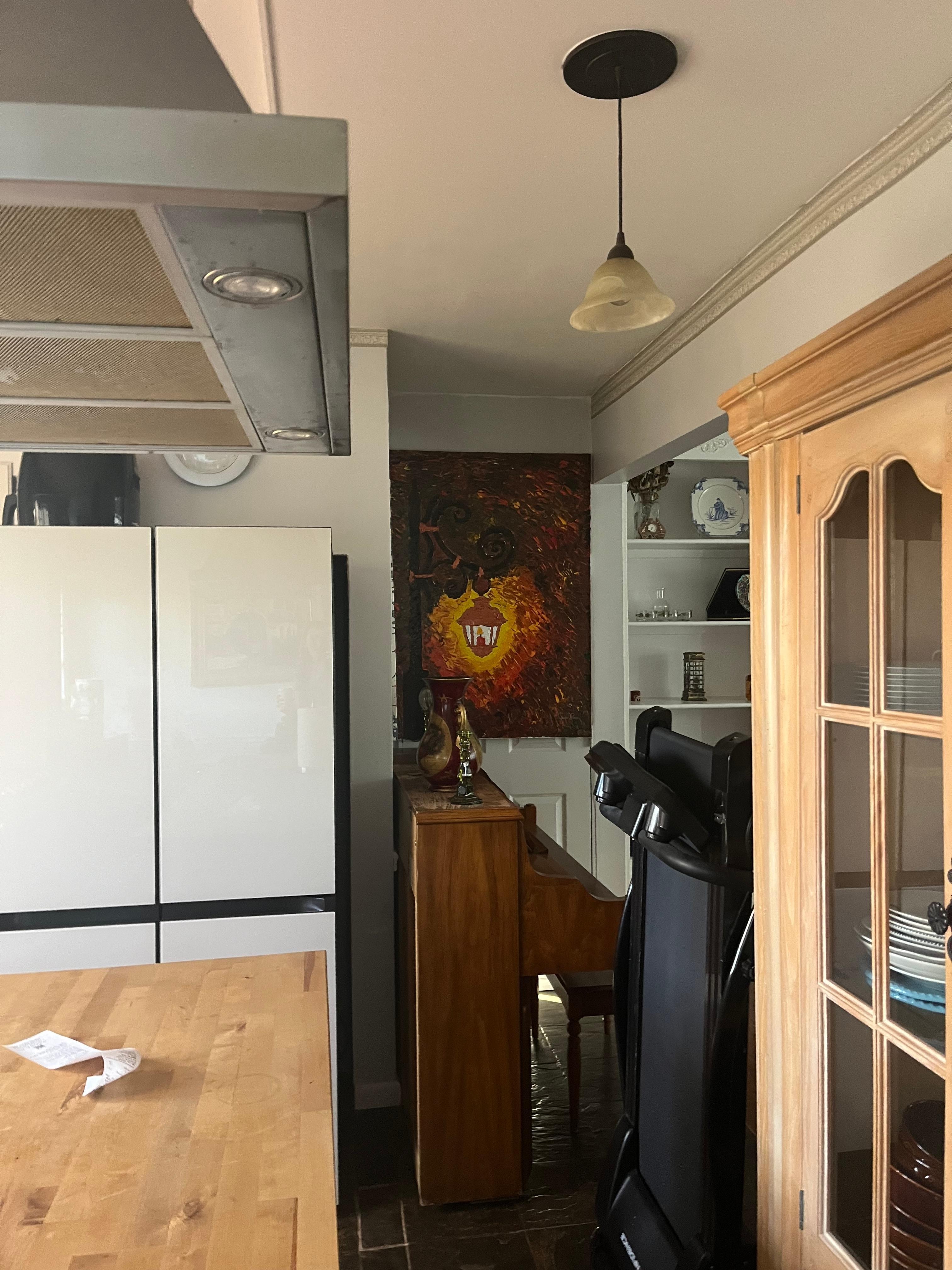 Door to separate apartment blocked by piano and treadmill 