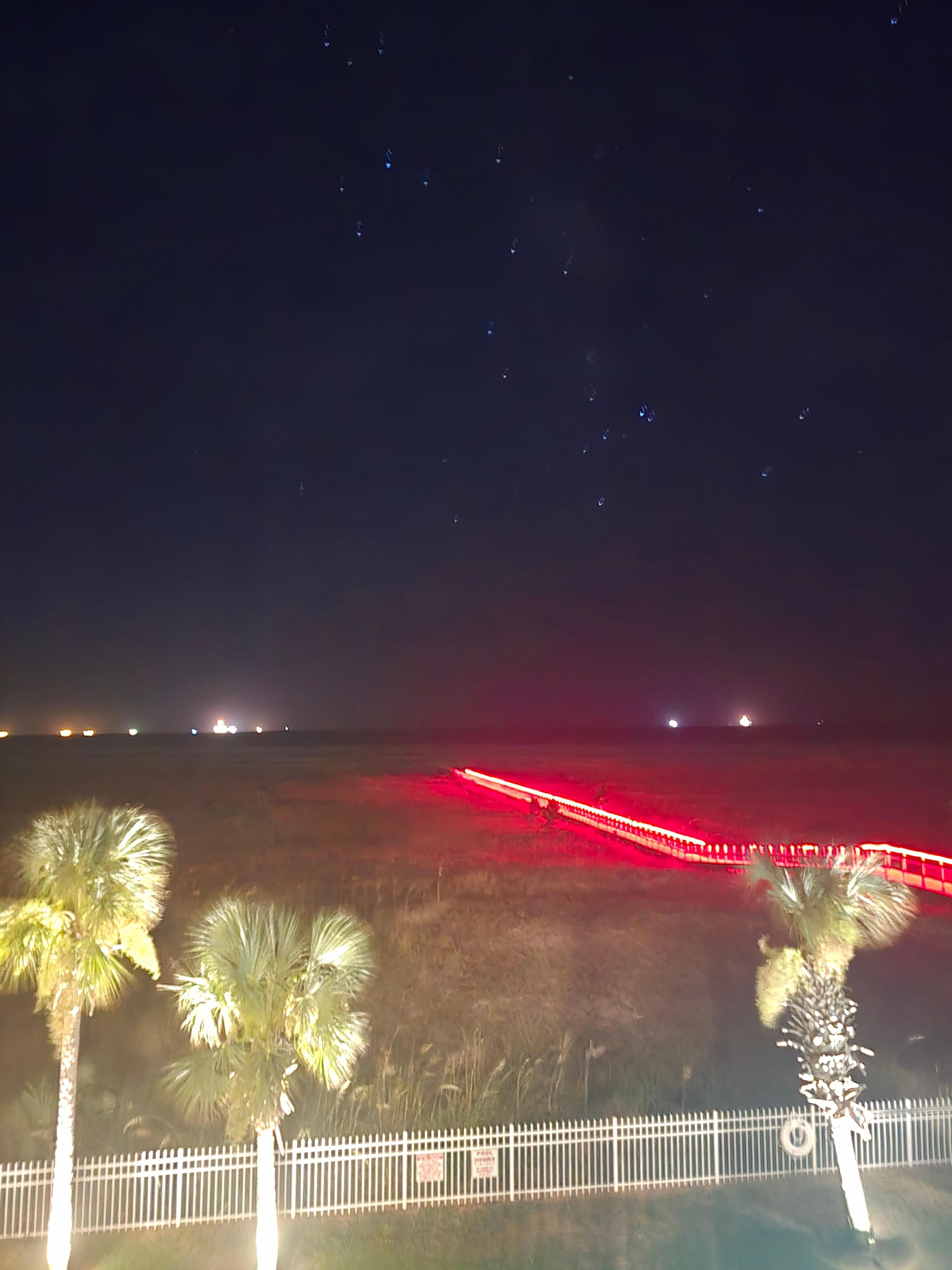 View from the balcony at night. The boardwalk to the beach is all lit up. Very pretty!