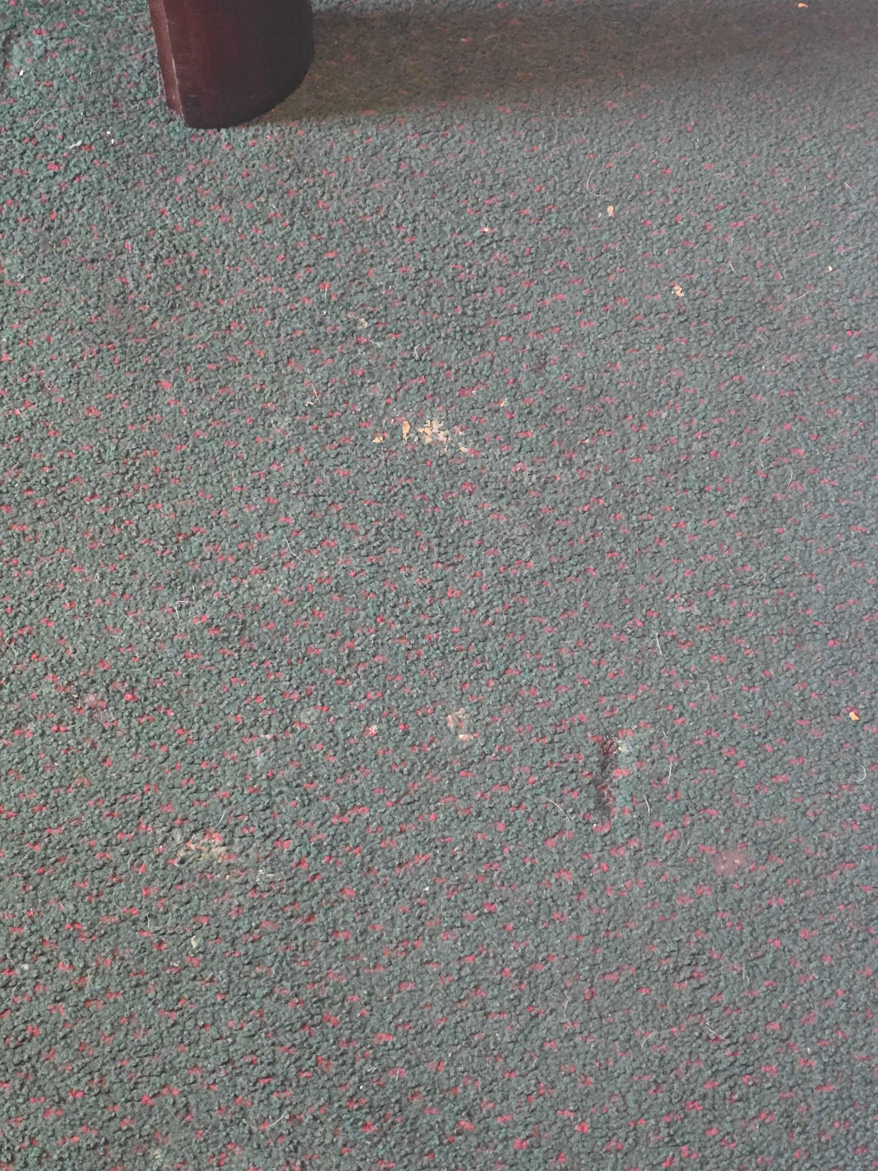 Floor next to the bed.