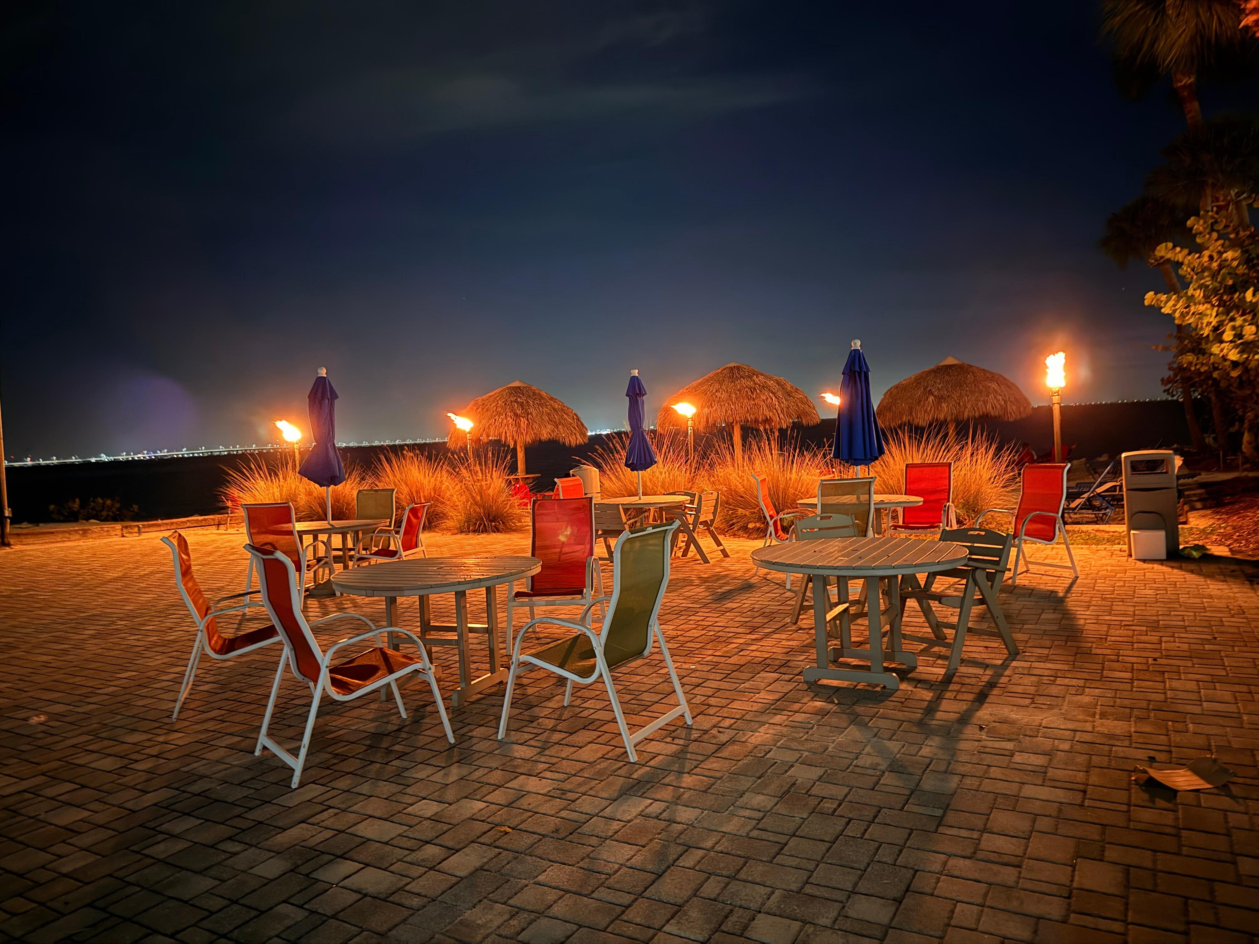 Beach area at night with fire pit