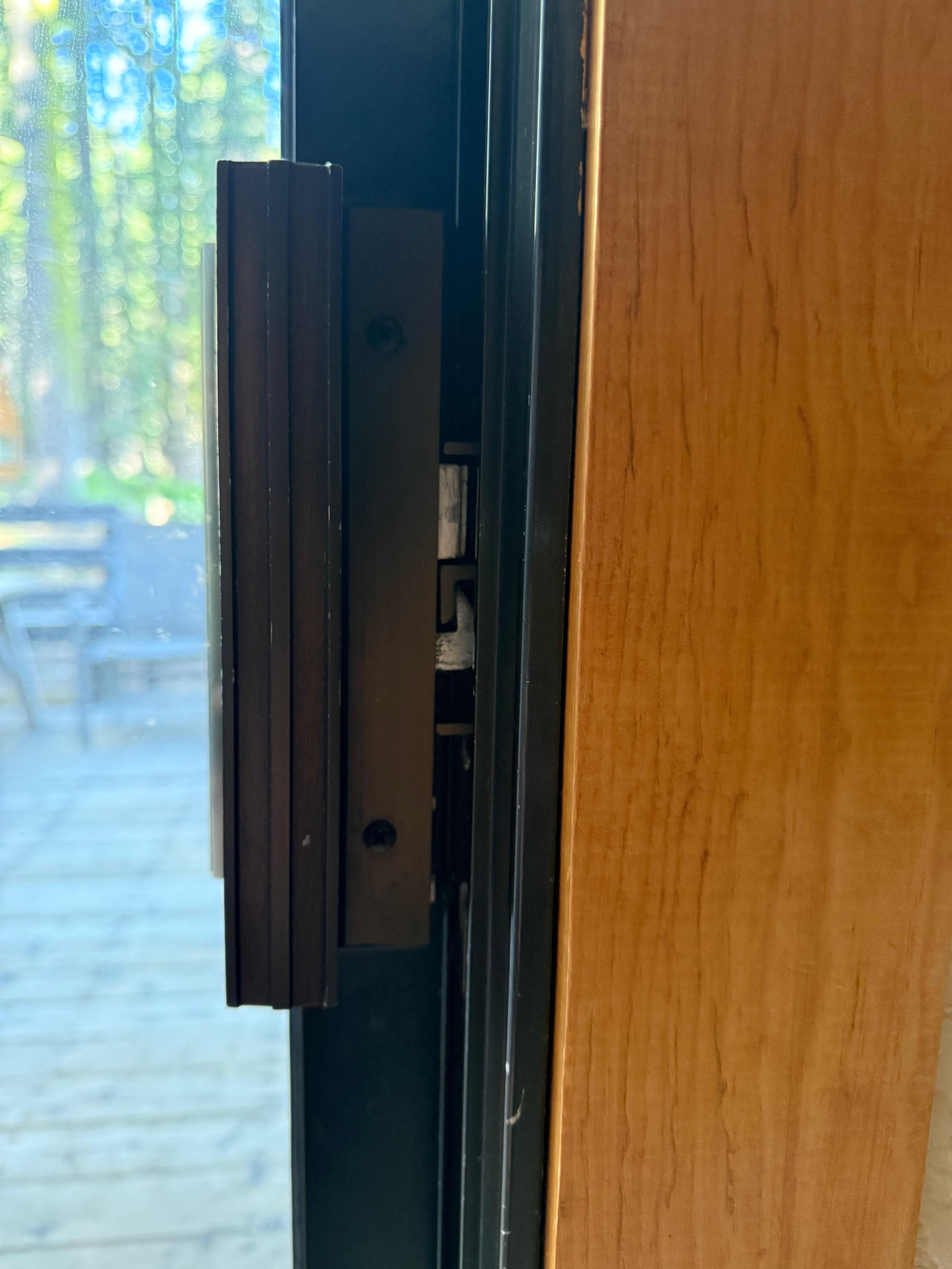 Sliding door missing panel to keep lock from being pushed I 