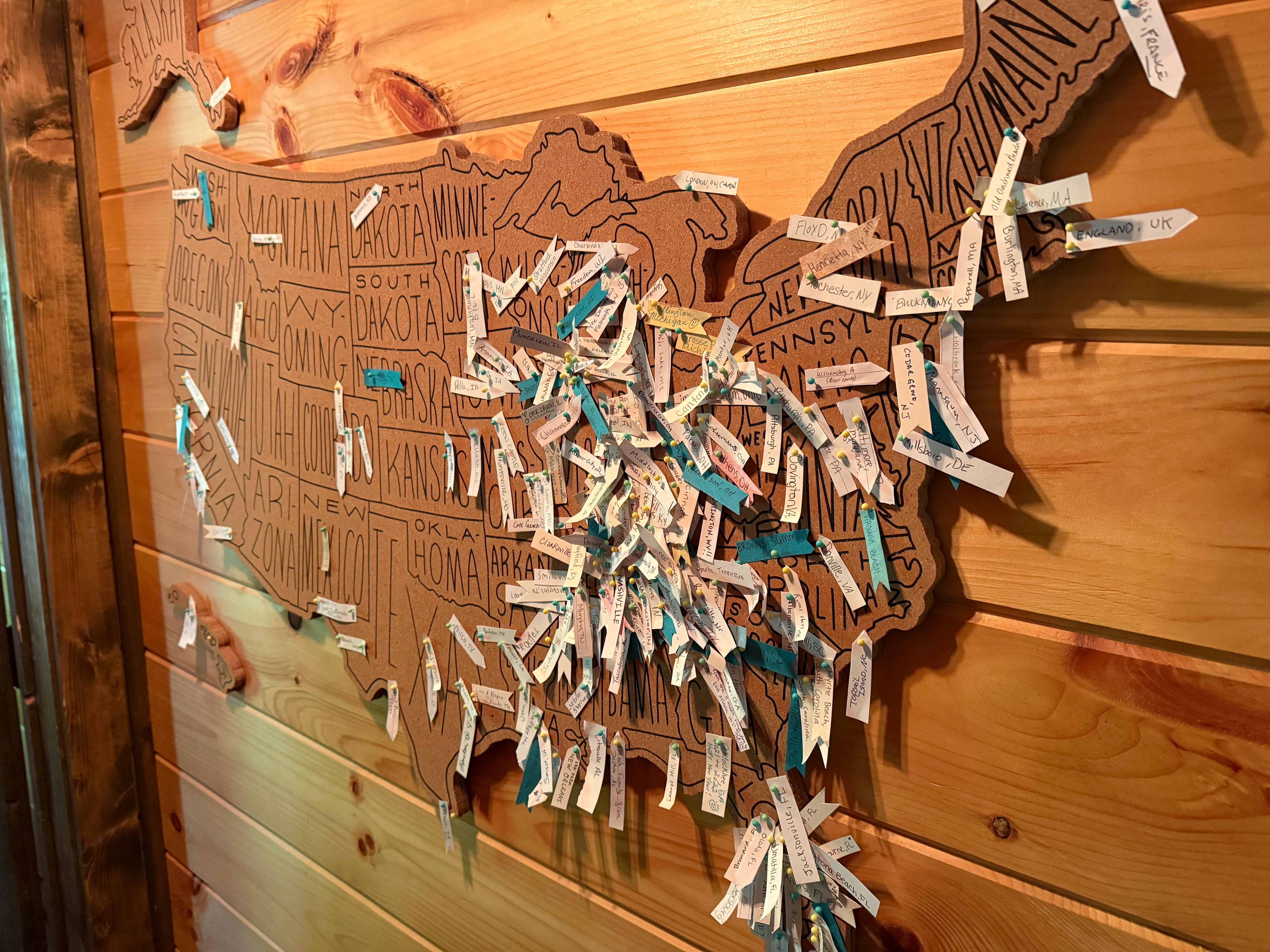 Love this idea of placing all the travelers locations on the cork map. 