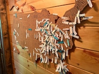 Love this idea of placing all the travelers locations on the cork map.