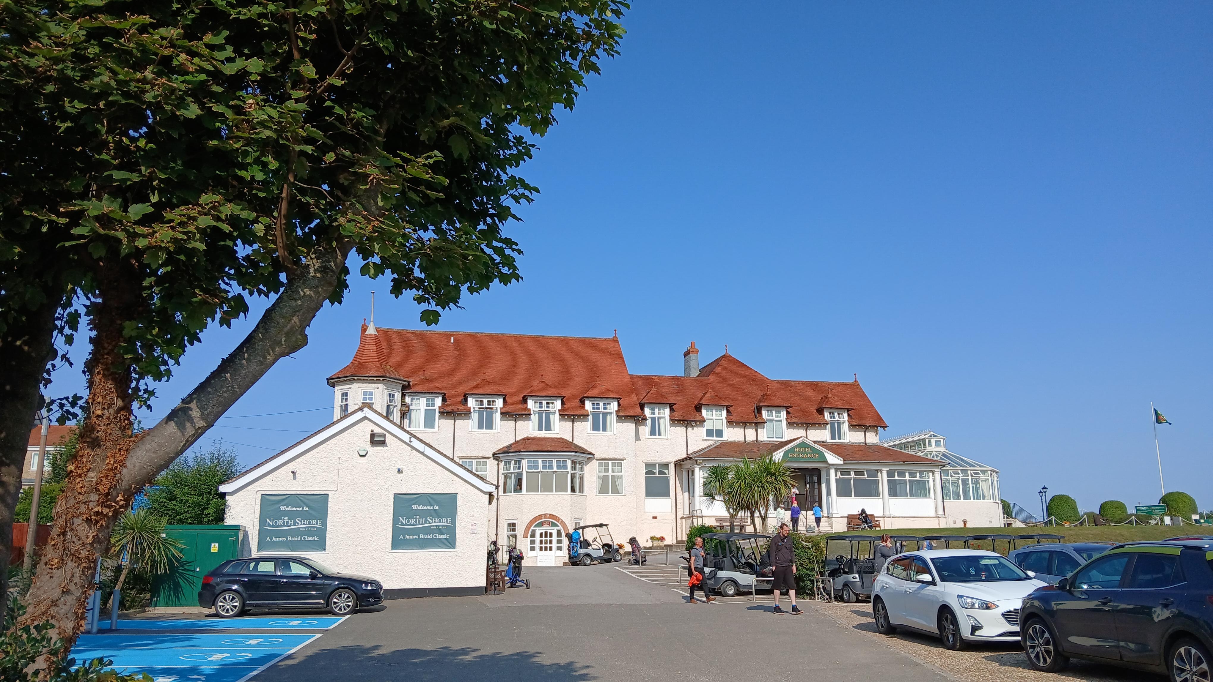 Hotel overlooks the dunes next to the sea.
