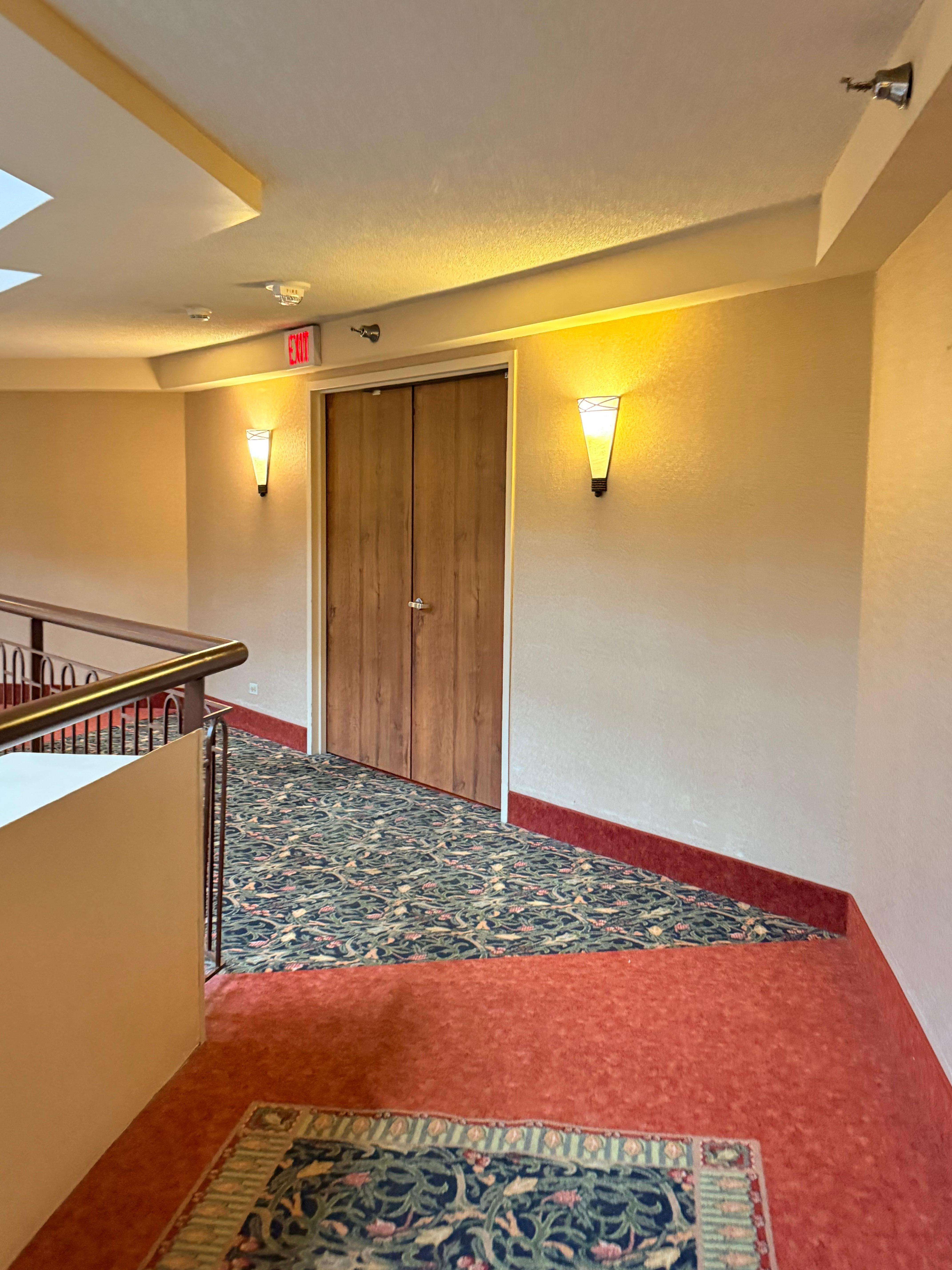 No signage to indicate there were hotel rooms behind this door. They said there was. Clearly there is not. 