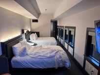 Great room, sheets, pillows, and bed. Fun with all the windows.