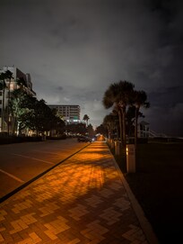 Lit walking path to Pier