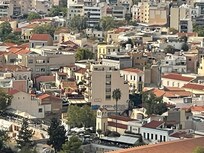 MiraMe as seen from on top of Acropolis (grey/blue building with black roof covering)