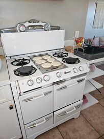 Cooking up pancakes on the vintage stove.
