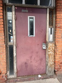Dilapidated front door.