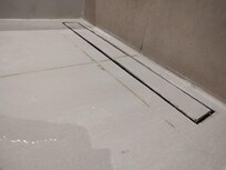 Water not training in bathroom shower