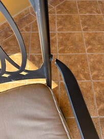 Metal arms pulled away from seat.