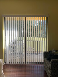 Private balcony with view of trees.