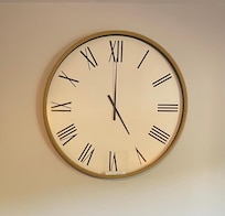 This clock is on the wall in the living room and 5:00 is always the time, as we were told that it's always 5:00 somewhere!