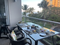 The wonderful lanai with such a pretty view over the garden to the ocean.