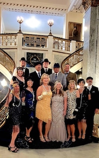 Photo Op on beautiful hotel stairs for a pre Derby party at Churchill Downs.