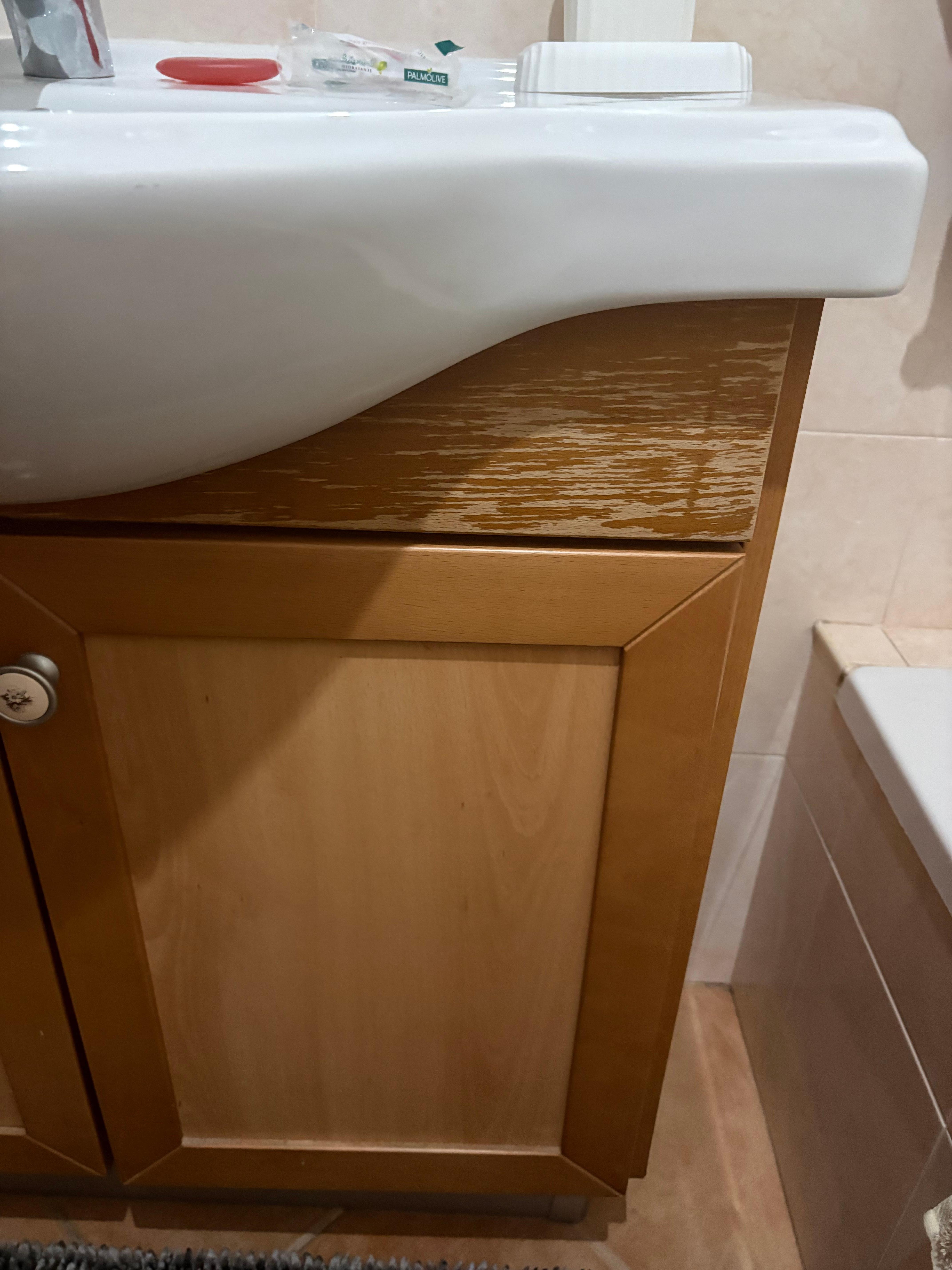 On suite bathroom, worn cabinets, shower head is old and didn’t put out water properly. 