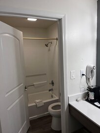 Clean & well lit bathroom & vanity