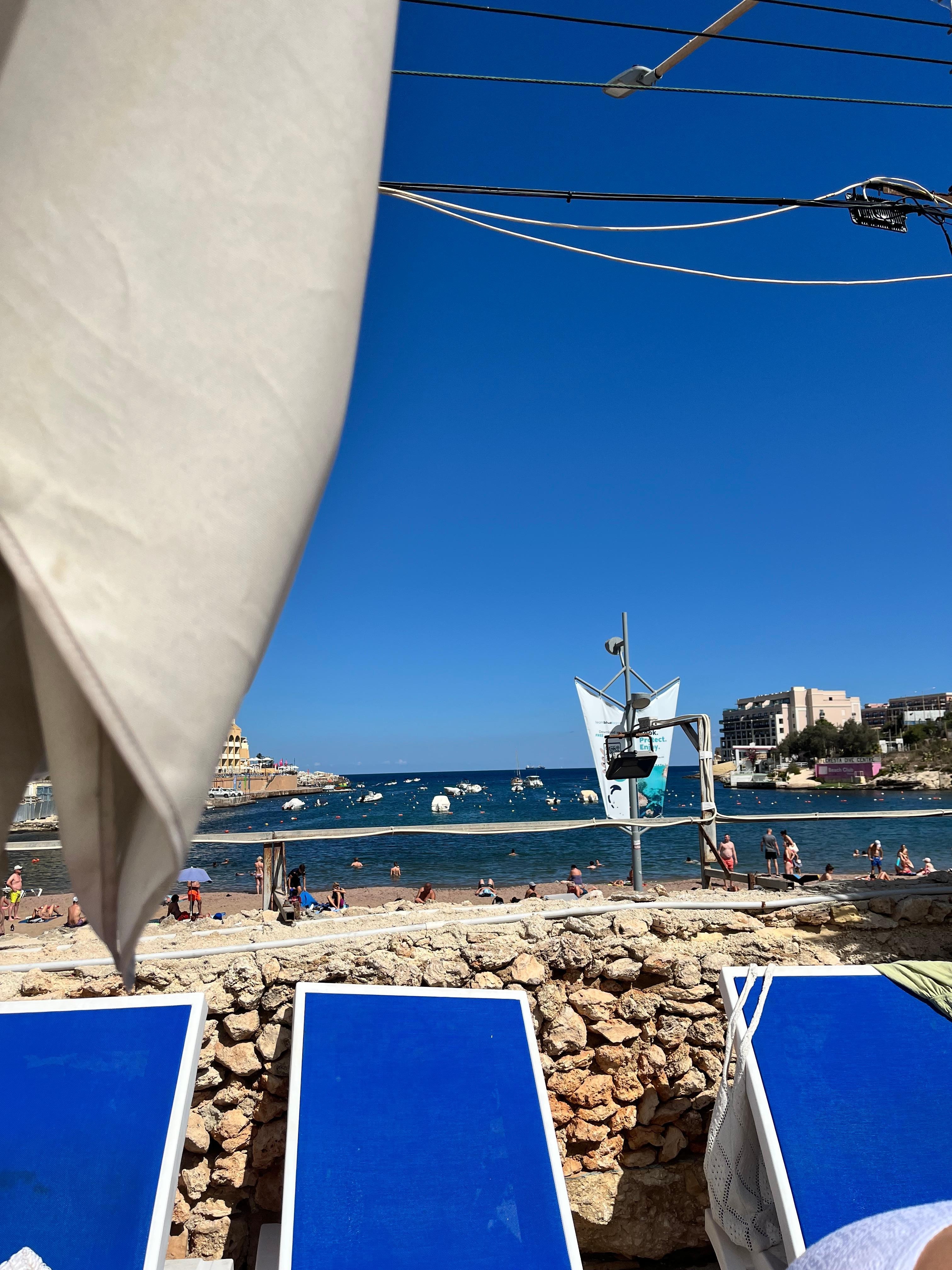 Pool looks over the beach bay