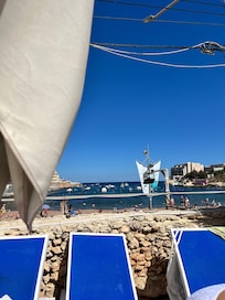 Pool looks over the beach bay