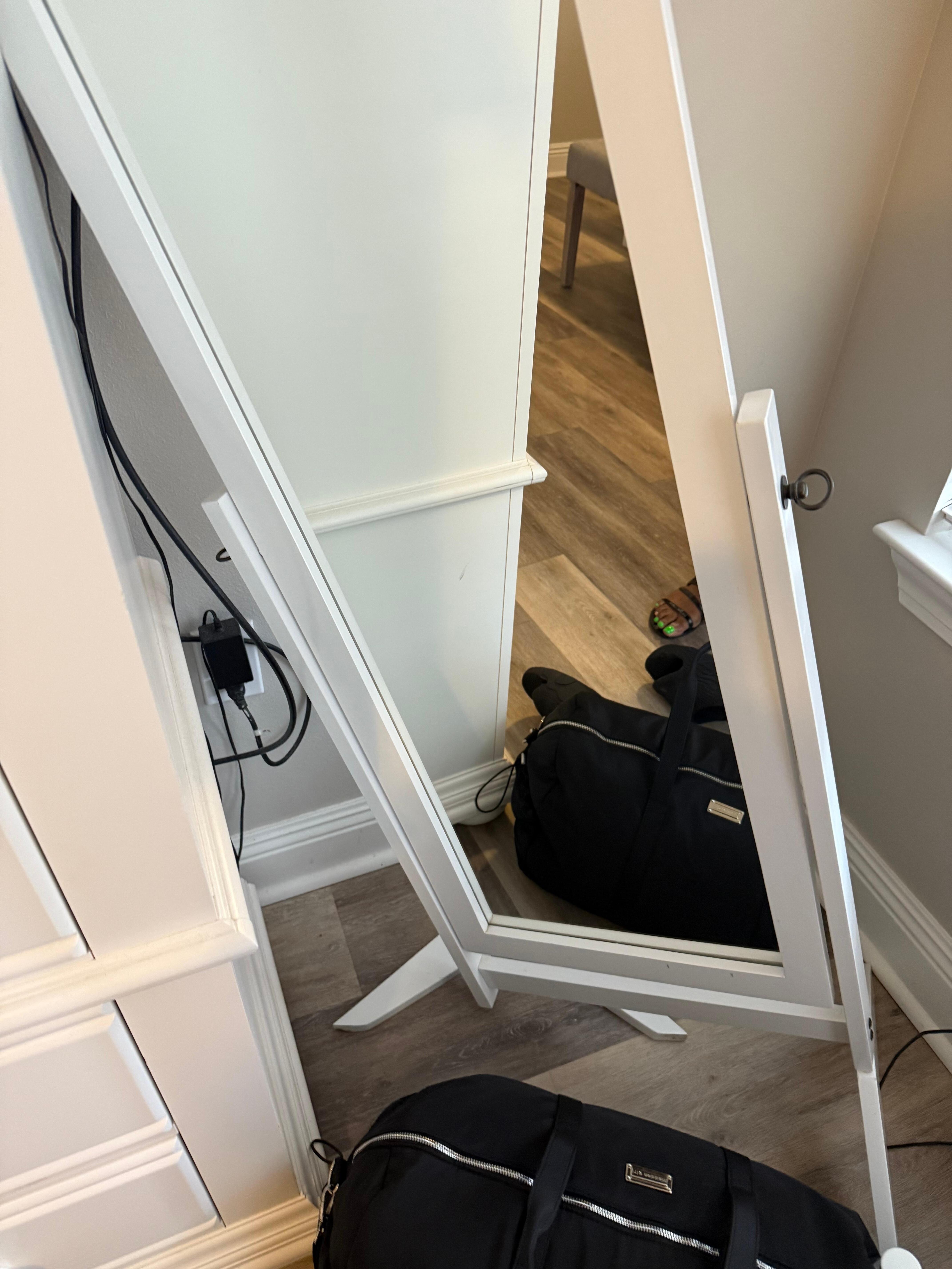 Mirror broken sitting in a corner 