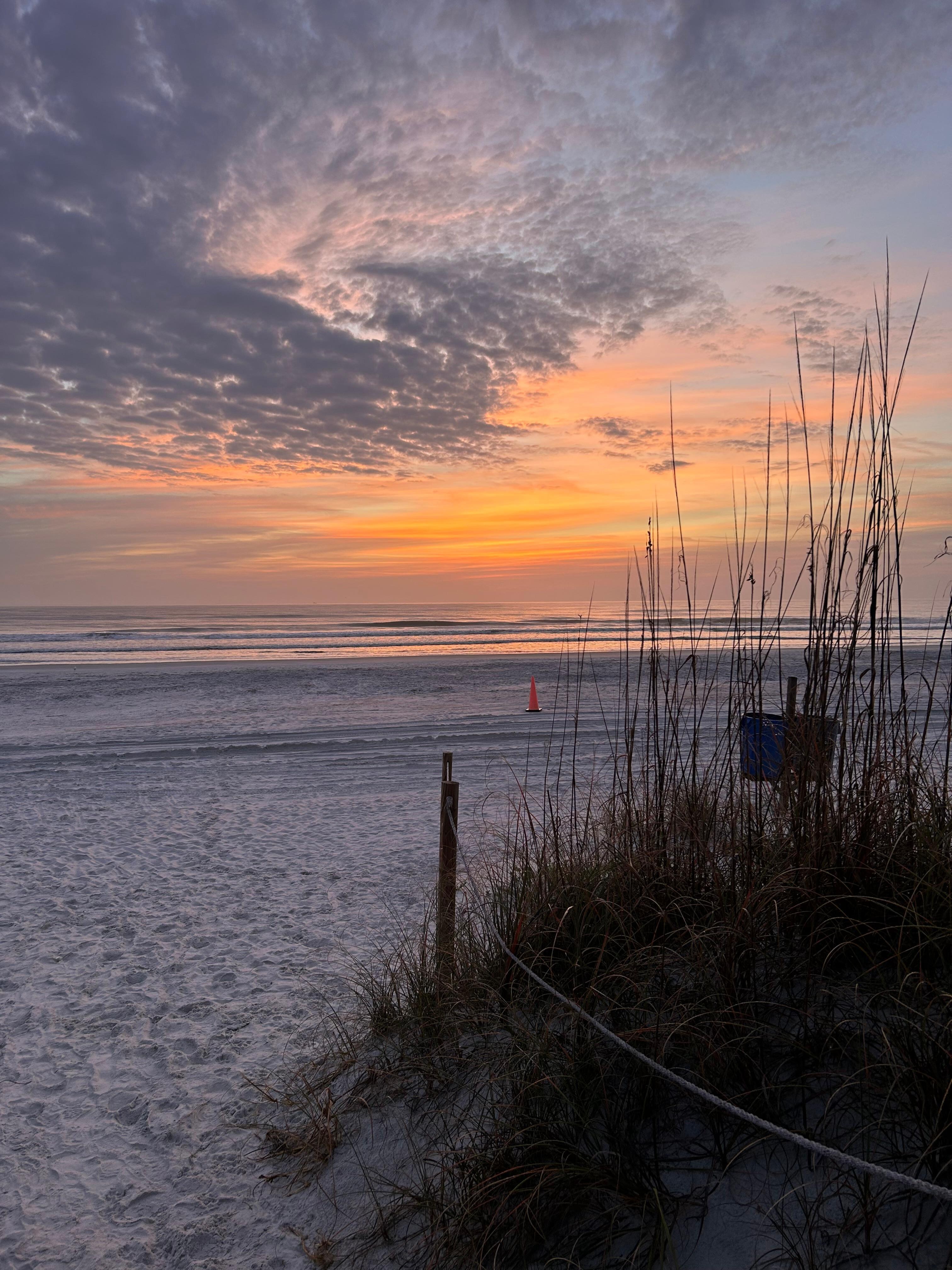 Sunrise at the beach close to house. 