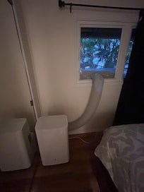 bedroom, window is blocked by AC, the limited floor space is taken