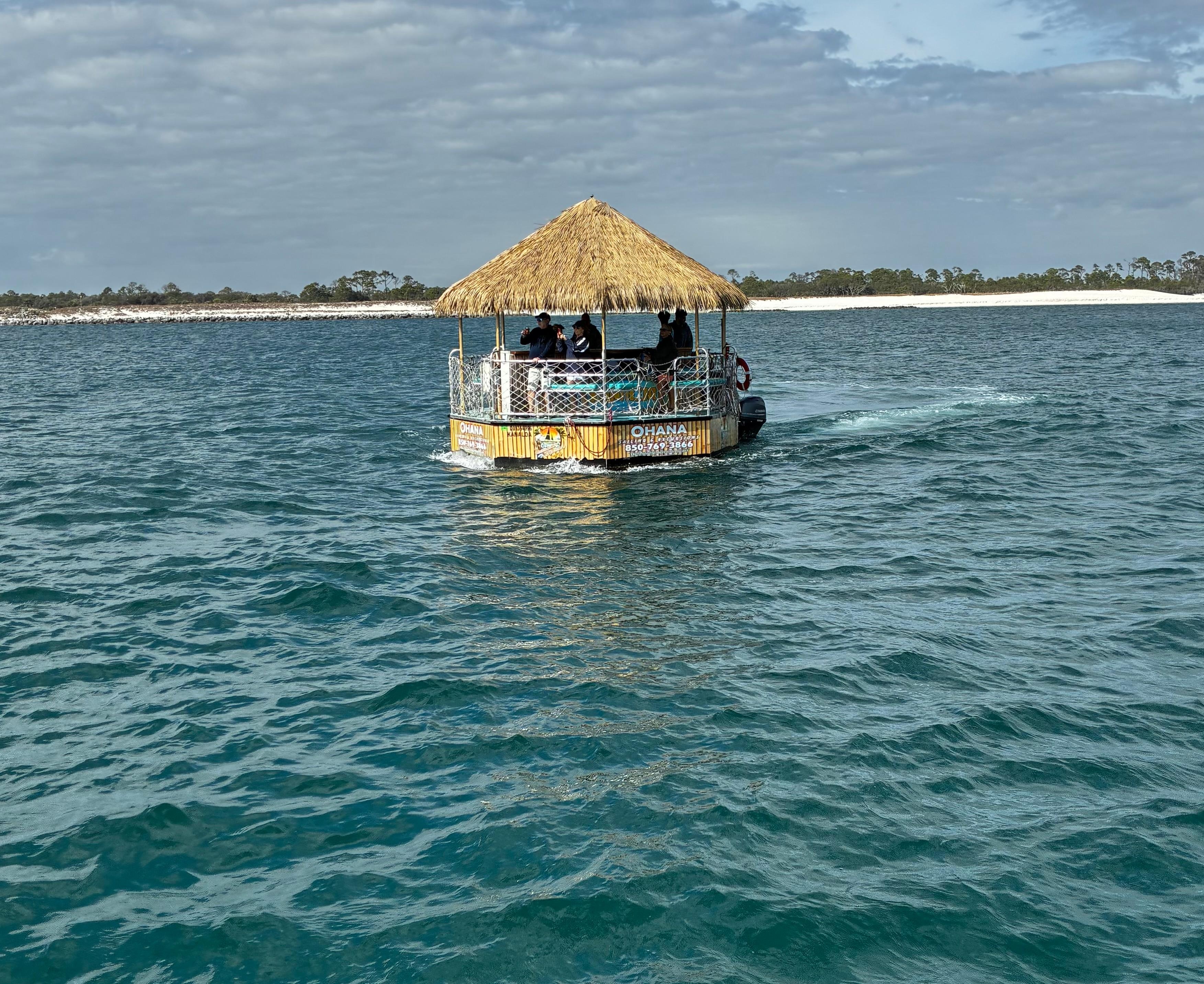 Tiki Boat seen on dolphin boat tour