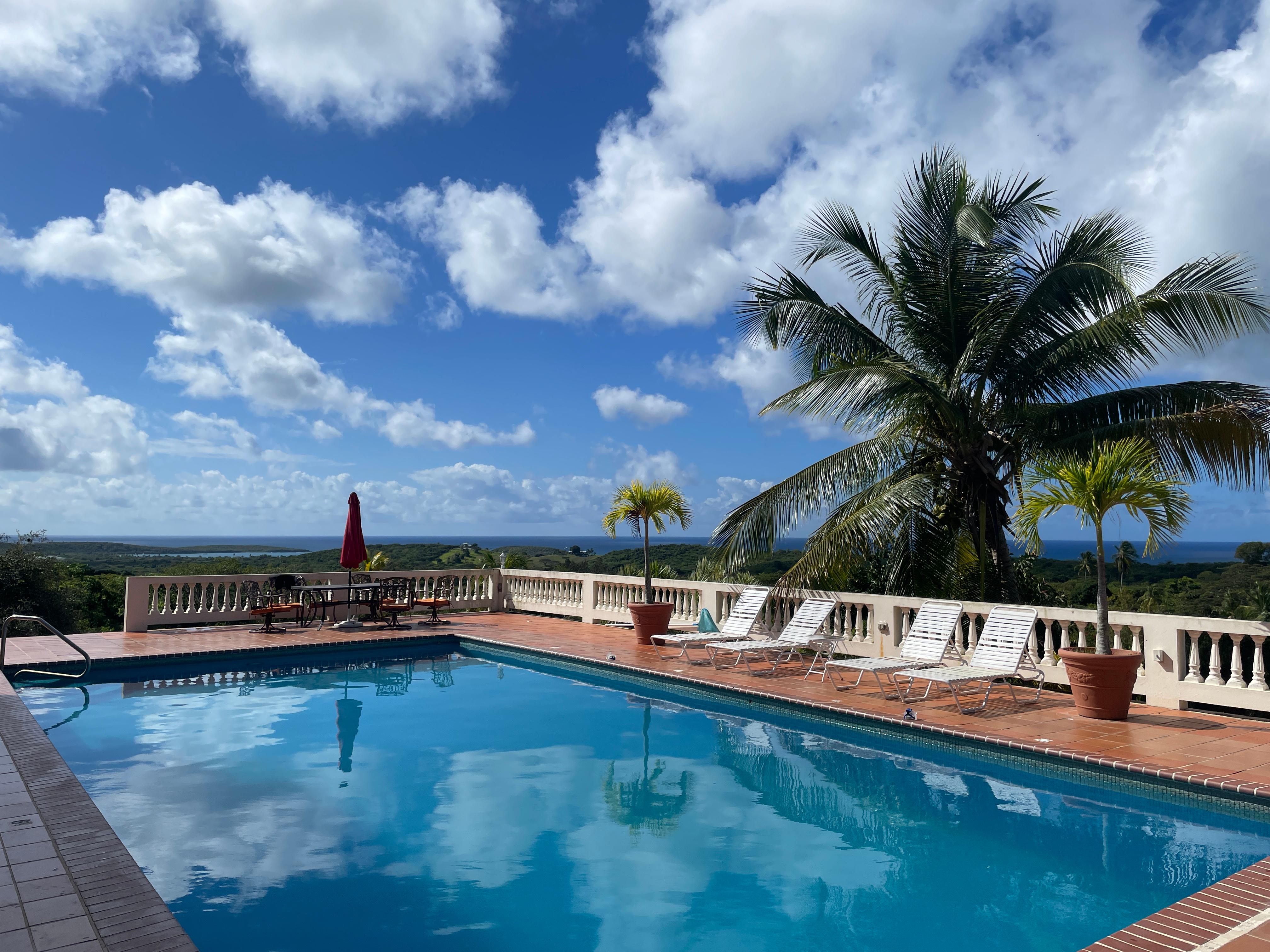 View looking out over the pool into Sun Bay Beach