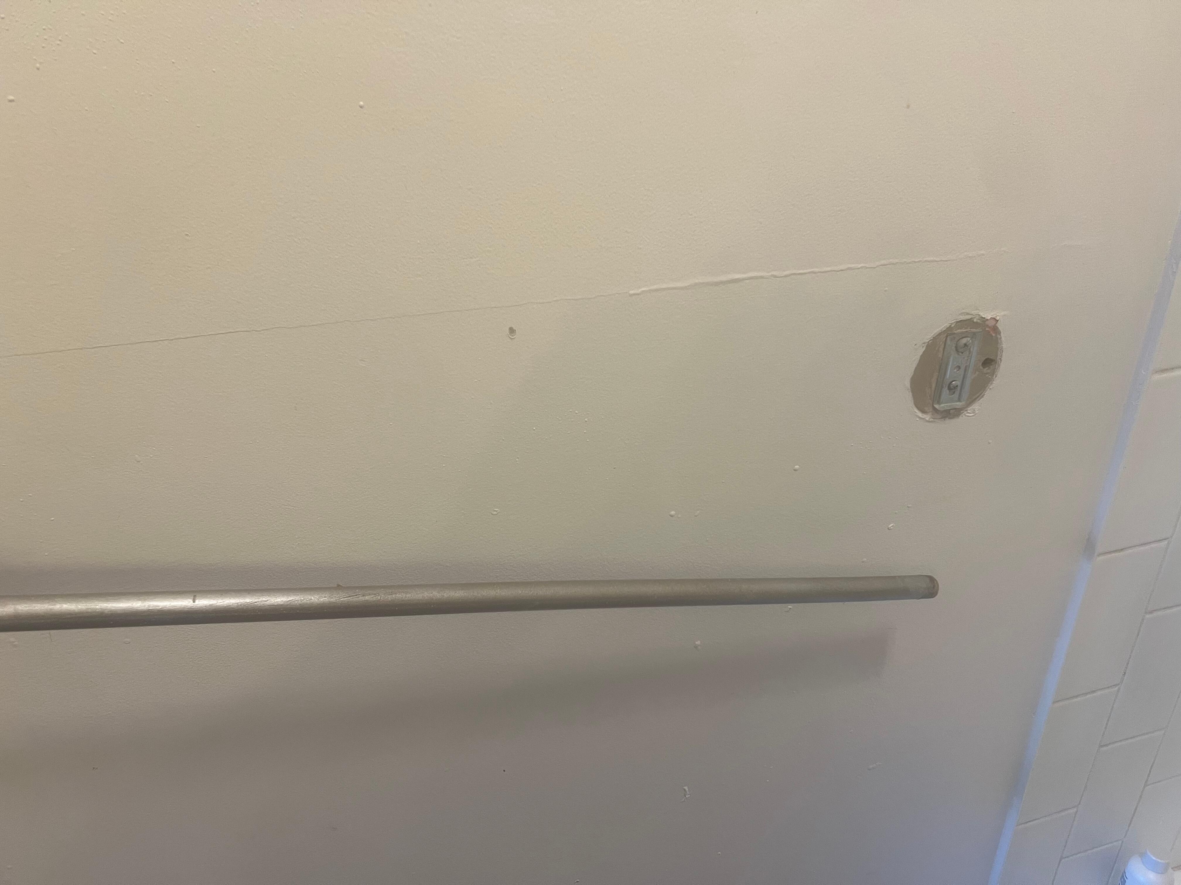 Broken towel holder- maintenance guy fixed it. 