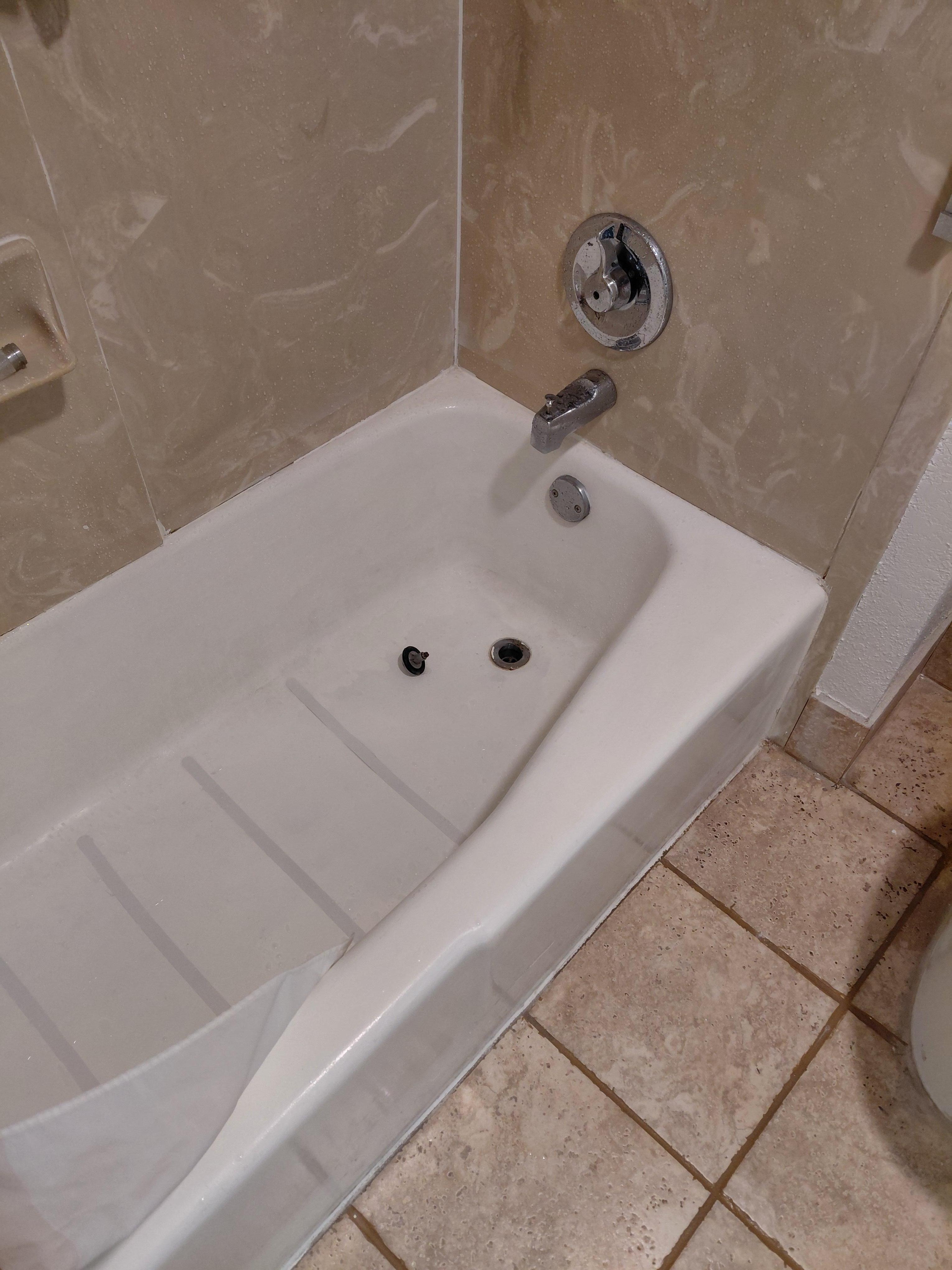 Tub filthy stopper just laying there faucet doesn't work no hot water and shower doesnt fit in holder