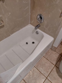 Tub filthy stopper just laying there faucet doesn't work no hot water and shower doesnt fit in holder