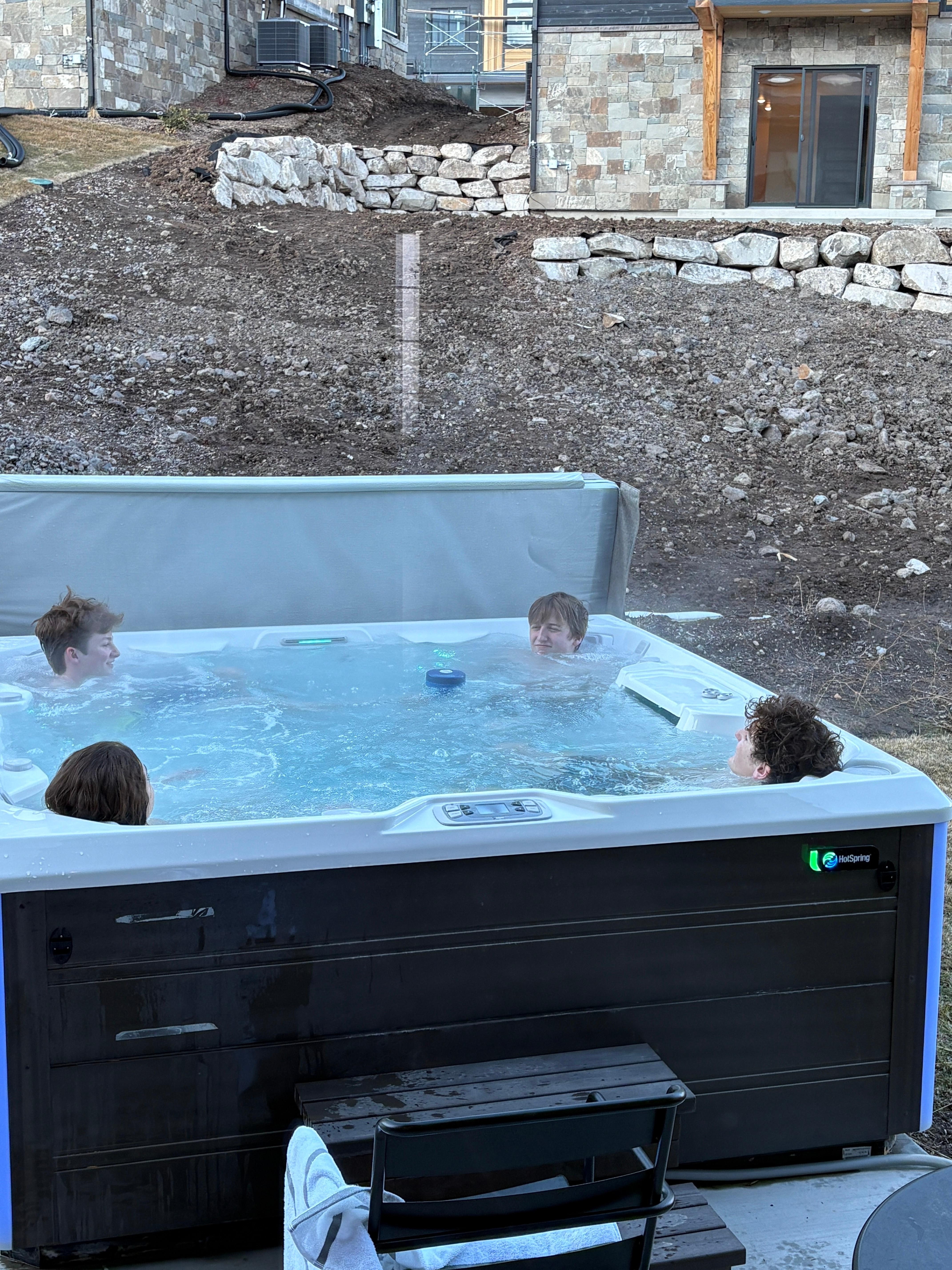 Hot tub on back patio w/ basket of plush towels just inside the back door was on point! 