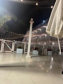 Courtyard with nice outdoor furniture and fire tables.