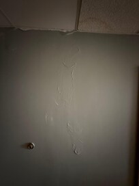 Water damage. More throughout room.