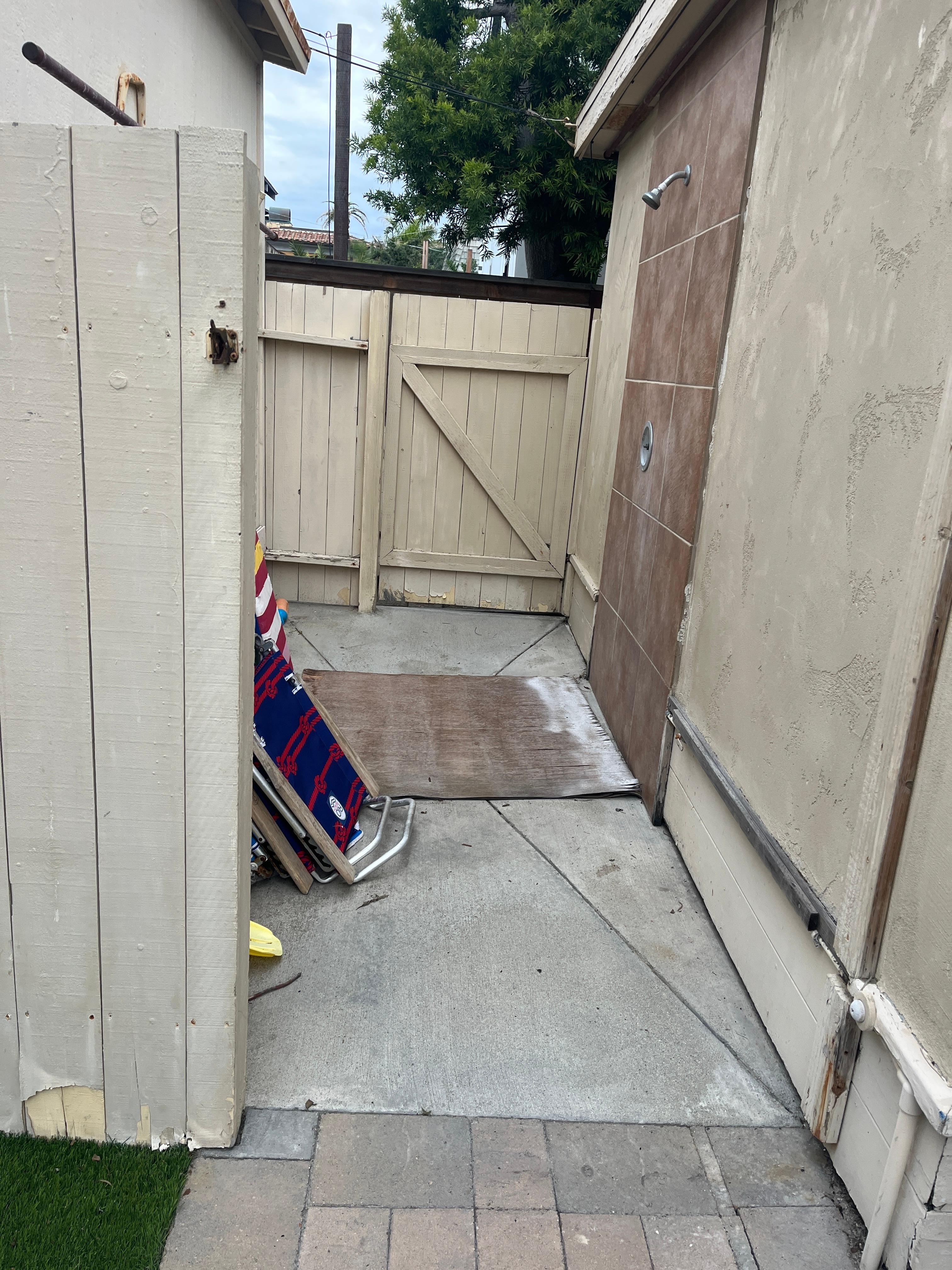 plywood over the shower drain 
