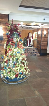 Santa and tree upon entrance to the Wilson Lodge