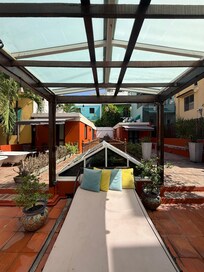 Rooftop area with view of suites and their patios.
