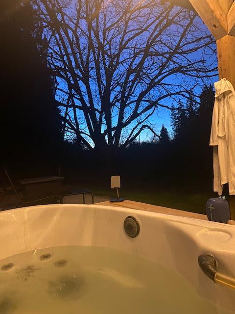 Outside private hot tub with outdoor rainshower